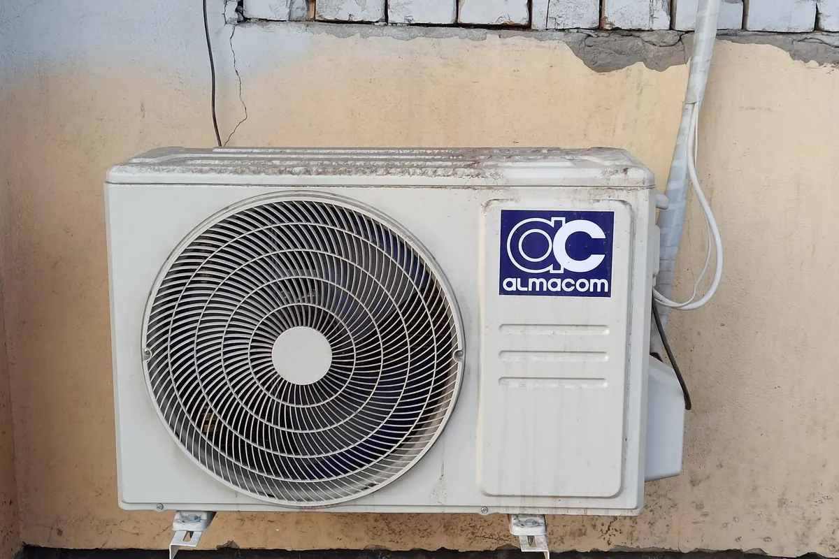 Mini-split outdoor unit mounted on an exterior wall