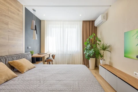 Bedroom with a wall-mounted mini split near the window