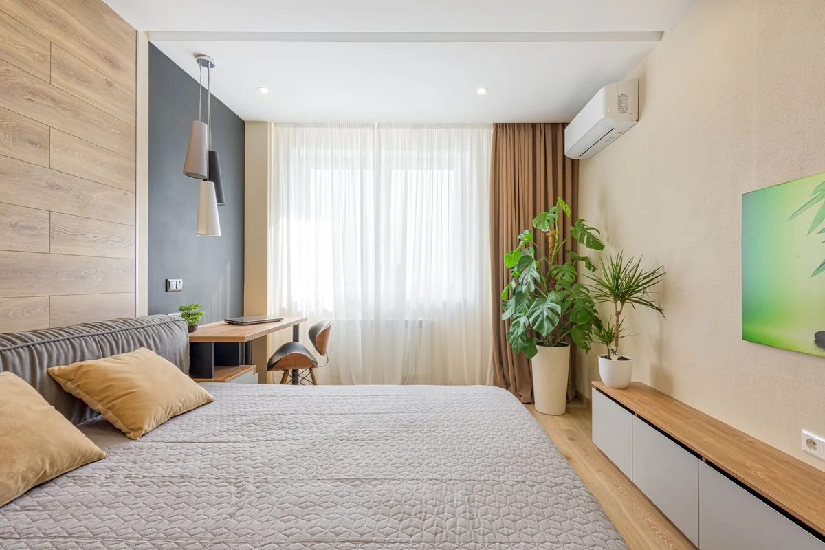 Bedroom with a wall-mounted mini split near the window